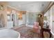 Bright and airy bathroom featuring a soaking tub, glass shower, and vanity with ample storage at 2 Bedons Aly, Charleston, SC 29401