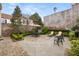 Brick courtyard with seating and lush landscaping, perfect for outdoor entertaining at 2 Bedons Aly, Charleston, SC 29401