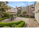Lush brick courtyard with multiple seating areas for enjoying outdoor living at 2 Bedons Aly, Charleston, SC 29401