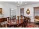 Elegant dining room features a chandelier, hardwood floors, and classic architectural details at 2 Bedons Aly, Charleston, SC 29401