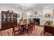 Classic dining room with hardwood floors, a fireplace, and a stylish china cabinet at 2 Bedons Aly, Charleston, SC 29401