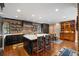Stunning kitchen featuring a brick wall, large island with seating, and stainless steel appliances at 2 Bedons Aly, Charleston, SC 29401
