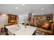 Cozy living area with a kitchen bar, exposed brick, and access to the patio at 2 Bedons Aly, Charleston, SC 29401