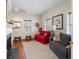 Cozy living room featuring hardwood floors, fireplace, and comfortable seating arrangements at 2 Bedons Aly, Charleston, SC 29401