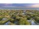 An aerial image showing a waterfront community nestled among trees with the ocean in view at 2 Wills Way, Isle of Palms, SC 29451