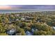 Aerial view of a neighborhood nestled amongst the trees near the coast at 2 Wills Way, Isle of Palms, SC 29451