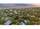 Aerial view showcasing community homes nestled amongst the trees near the beach at 2 Wills Way, Isle of Palms, SC 29451