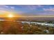 An aerial image of a waterfront community with a bridge visible in the distance at 2 Wills Way, Isle of Palms, SC 29451
