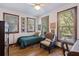 Cozy bedroom with hardwood floors, a daybed, chair, ceiling fan and lots of natural light at 2 Wills Way, Isle of Palms, SC 29451