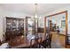 Spacious dining room featuring hardwood floors, dark wood furniture and an adjacent doorway to the kitchen at 2 Wills Way, Isle of Palms, SC 29451