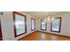 Bright dining room with large windows, hardwood floors, and a chandelier at 2 Wills Way, Isle of Palms, SC 29451