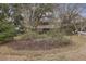 Charming two-story home with a porch nestled amongst lush trees and landscape at 2 Wills Way, Isle of Palms, SC 29451