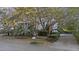 Charming two-story home with a landscaped front yard, mature trees, and a inviting driveway at 2 Wills Way, Isle of Palms, SC 29451