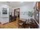 Cozy eat-in kitchen featuring wood floors, a breakfast nook with a dining table, and stainless steel appliances at 2 Wills Way, Isle of Palms, SC 29451