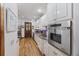 Bright, modern kitchen with stainless steel oven and white cabinets, offering plenty of storage and counter space at 2 Wills Way, Isle of Palms, SC 29451