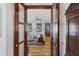 Open doorway view into the living room with a white sofa and hardwood floors at 2 Wills Way, Isle of Palms, SC 29451