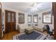 Bright living room featuring hardwood floors, neutral sofas, area rug, and natural light from multiple windows at 2 Wills Way, Isle of Palms, SC 29451