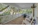 Relaxing porch with rocking chairs and a table, offering a comfortable spot to enjoy the view at 2 Wills Way, Isle of Palms, SC 29451