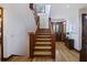 Inviting staircase featuring wood stairs, natural light, and views into adjacent rooms at 2 Wills Way, Isle of Palms, SC 29451