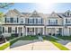 Charming townhouses with inviting front porches, landscaping, and black shutters, offering curb appeal at 202 Kirkland St, Goose Creek, SC 29445