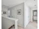 Bright hallway featuring neutral paint, carpet, and access to bathroom and bedrooms at 202 Kirkland St, Goose Creek, SC 29445