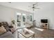 Open-concept living room features hardwood floors, neutral décor, and bright natural light at 202 Kirkland St, Goose Creek, SC 29445