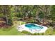 Aerial view of a private backyard oasis with a luxurious pool and lush greenery at 2111 Nicholas David Path, Johns Island, SC 29455