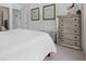 Spacious bedroom with a cozy white quilt and elegant furnishings, creating a relaxing sanctuary at 2111 Nicholas David Path, Johns Island, SC 29455