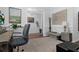 Stylish home office with decorative rug, wall art and light gray walls at 2111 Nicholas David Path, Johns Island, SC 29455