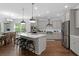 Modern kitchen with white cabinets, stainless steel appliances, and a large island at 2111 Nicholas David Path, Johns Island, SC 29455