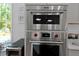 Close up view of a stainless steel oven and microwave with white cabinets at 2111 Nicholas David Path, Johns Island, SC 29455