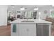 Kitchen island with stainless steel dishwasher, sink, and an open view to living room at 2111 Nicholas David Path, Johns Island, SC 29455