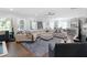 Open-concept living room with a large sofa and seamless access to the kitchen at 2111 Nicholas David Path, Johns Island, SC 29455
