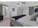 Comfortable main bedroom featuring a rustic barn door and neutral colors that creates a serene retreat at 2111 Nicholas David Path, Johns Island, SC 29455