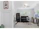 Office space with gray walls, hardwood floors, piano, wine fridge, and decorative rug at 2111 Nicholas David Path, Johns Island, SC 29455