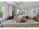 Open concept dining and kitchen area with hardwood floors at 2111 Nicholas David Path, Johns Island, SC 29455