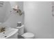 Stylish powder room with plank walls and a modern sink at 2111 Nicholas David Path, Johns Island, SC 29455