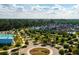 Aerial community view of homes, pool, and green spaces, promoting a vibrant and active lifestyle at 225 Denham St, Summerville, SC 29486