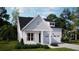 Charming exterior elevation showcases a two-car garage, covered porch, and manicured lawn at 225 Denham St, Summerville, SC 29486