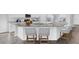 Gourmet kitchen with stainless steel appliances, granite countertops, and an expansive island with barstool seating at 225 Denham St, Summerville, SC 29486