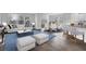 The living room and kitchen in an open floorplan are filled with bright, natural light and modern finishes at 225 Denham St, Summerville, SC 29486