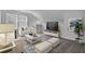 Cozy loft-style living room area with comfortable seating and a large television for entertainment at 225 Denham St, Summerville, SC 29486