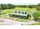 Aerial view of a charming house with a green roof, situated on a golf course at 225 Silverwood Ln, Summerville, SC 29485