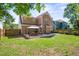 Spacious backyard with patio, gazebo with dining, grill and lush green lawn, perfect for outdoor enjoyment at 225 Silverwood Ln, Summerville, SC 29485