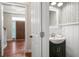 Stylish half-bathroom featuring patterned wallpaper, a modern vanity, and sleek fixtures at 225 Silverwood Ln, Summerville, SC 29485