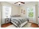 Inviting bedroom with a comfortable bed, wood floors, and bright natural light, creating a cozy and restful atmosphere at 225 Silverwood Ln, Summerville, SC 29485