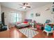 Well-lit bedroom showcasing a cozy bed, study desk, hardwood floors, and colorful decorations at 225 Silverwood Ln, Summerville, SC 29485
