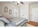 Bedroom with hardwood floors, a comfortable bed, neutral walls, and double closet doors, providing ample storage space at 225 Silverwood Ln, Summerville, SC 29485