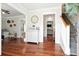 Inviting foyer with rich wood floors, staircase, decorative cabinet, and neutral paint at 225 Silverwood Ln, Summerville, SC 29485