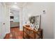 Hallway with hardwood floors, a decorative table, and an open doorway to the living room at 225 Silverwood Ln, Summerville, SC 29485